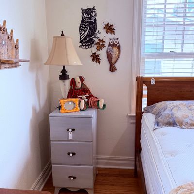 Sale Photo Thumbnail #41: A painted gray three-drawer nightstand