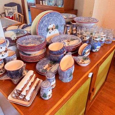 Sale Photo Thumbnail #8: Winter cabin themed dinnerware, including plates, bowls, mugs, glassware, and matching serving pieces.