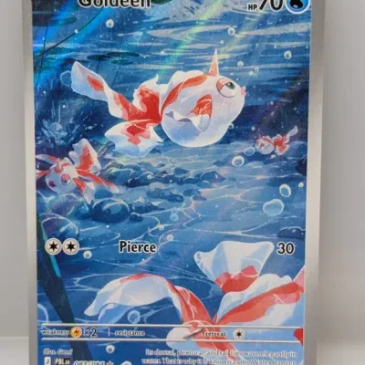 Sale Photo Thumbnail #141: Pokémon Trading Card Game Goldeen illustration rare card (087/084) featuring full-art foil artwork, in excellent condition.