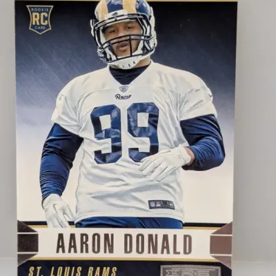 Sale Photo Thumbnail #334: 2014 Panini Rookies & Stars Aaron Donald rookie trading card (#99) featuring the defensive tackle in a St. Louis Rams uniform.