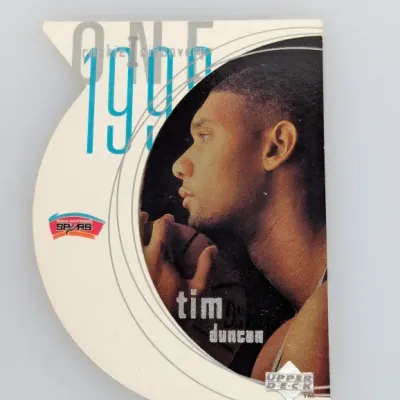 Sale Photo Thumbnail #585: 1997-98 Upper Deck Rookie Discovery Tim Duncan die-cut basketball card #R1.