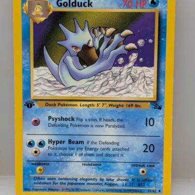 Sale Photo Thumbnail #796: 1st Edition Golduck #35/62 Pokémon trading card from the 1999 Fossil set, illustrated by Kagemaru Himeno.