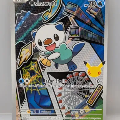 Sale Photo Thumbnail #659: Pokémon Oshawott full-art promo card (051) from the Mega Evolution / Celebrations series, featured in mint condition.