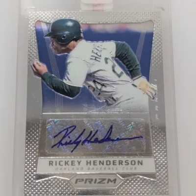 Sale Photo Thumbnail #11: Panini Prizm Rickey Henderson autographed baseball card encased in a protective hard plastic holder.