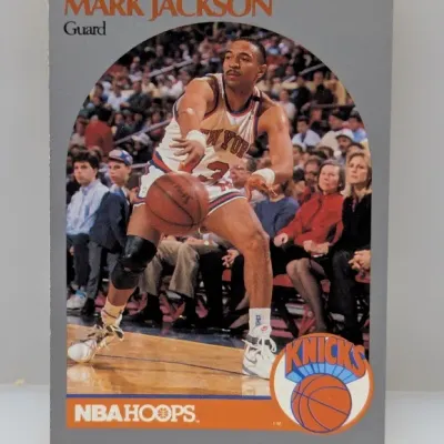 Sale Photo Thumbnail #652: 1990-91 NBA Hoops Mark Jackson basketball card #205 featuring the Menendez brothers in the background crowd.