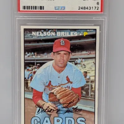 Sale Photo Thumbnail #249: PSA-graded EX-MT 6 copy of a 1967 Topps Nelson Briles baseball card (#404) in a protective slab.