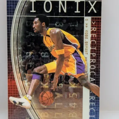 Sale Photo Thumbnail #241: 1999-00 Upper Deck Ionix Reciprocal #31 Kobe Bryant trading card, featuring the Los Angeles Lakers guard in an action shot.