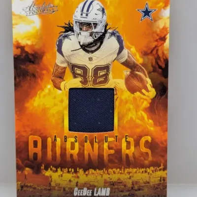 Sale Photo Thumbnail #942: Panini Absolute Football CeeDee Lamb "Absolute Burners" relic trading card featuring a navy blue jersey swatch.