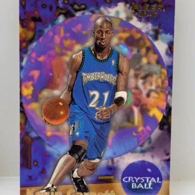 Sale Photo Thumbnail #709: 1996-97 Fleer Kevin Garnett 'Crystal Ball' basketball trading card (#1 of 11 CB). The card features a colorful holofoil finish and depicts Garnett in his Minnesota Timberwolves uniform.
