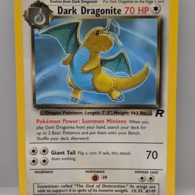 Sale Photo Thumbnail #378: Pokémon Team Rocket set Dark Dragonite 22/82 non-holo card, produced by Wizards of the Coast circa 2000.