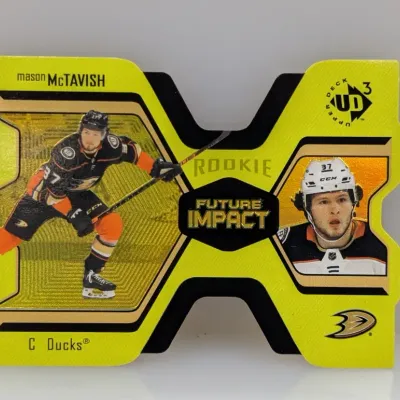 Sale Photo Thumbnail #160: Upper Deck Mason McTavish Rookie Future Impact die-cut hockey trading card in bright yellow and gold, featuring the Anaheim Ducks player.