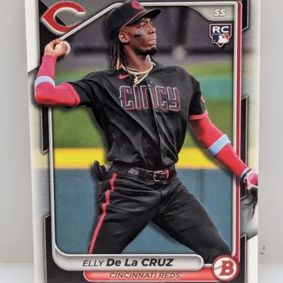 Sale Photo Thumbnail #623: Bowman Elly De La Cruz Cincinnati Reds rookie baseball card, featuring the player in a black City Connect uniform.