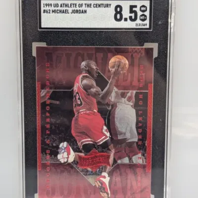 Sale Photo Thumbnail #41: SGC-graded 8.5 NM/MT+ 1999 Upper Deck Athlete of the Century Michael Jordan #62 trading card, encased in a protective slab.