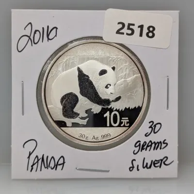 Sale Photo Thumbnail #1009: 2016 Chinese Silver Panda 10 Yuan coin, 30 grams of .999 fine silver, displayed in a cardboard coin flip holder.
