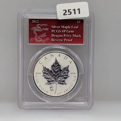 Sale Photo Thumbnail #1002: PCGS-graded SP Gem 2012 Canadian $5 Silver Maple Leaf Reverse Proof coin featuring a Dragon Privy Mark, encased in a protective slab.