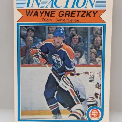 Sale Photo Thumbnail #636: 1981-82 O-Pee-Chee Wayne Gretzky "In Action" #106 hockey card featuring him in an Edmonton Oilers uniform.