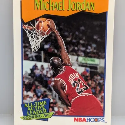Sale Photo Thumbnail #821: 1990-91 NBA Hoops Michael Jordan #65 basketball card, featuring the Chicago Bulls star dunking with the All-Time Active Leader Scoring Avg. graphic.