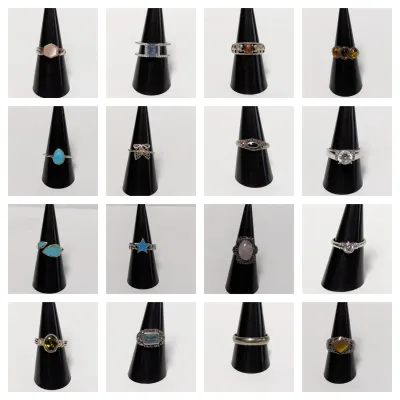 Sale Photo Thumbnail #5: Photo grid displaying sixteen various sterling silver and fashion rings with gemstones, enamel, and marcasite on black displays.