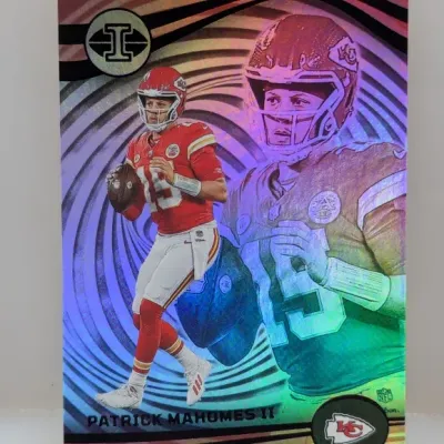 Sale Photo Thumbnail #908: Panini Illusions Patrick Mahomes II trading card featuring a vibrant holographic finish.