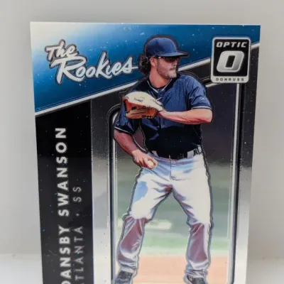 Sale Photo Thumbnail #640: 2017 Donruss Optic Dansby Swanson 'The Rookies' baseball trading card for the Atlanta Braves.