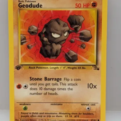 Sale Photo Thumbnail #787: 1st Edition Geodude #47/62 Pokémon trading card from the 1999 Fossil set, illustrated by Kagemaru Himeno.