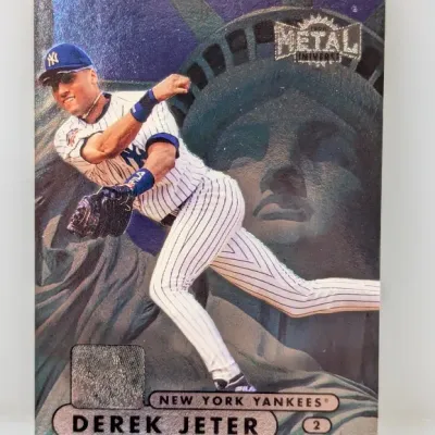 Sale Photo Thumbnail #415: 1998 Metal Universe Derek Jeter baseball card #2 featuring a metallic finish and Statue of Liberty background graphics.