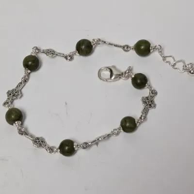 Sale Photo Thumbnail #976: Sterling silver Celtic cross link bracelet featuring dark green marble or jasper round beads with a lobster claw clasp and extender chain.