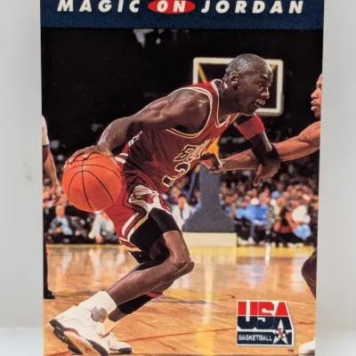 Sale Photo Thumbnail #917: 1991-92 Upper Deck Basketball card featuring Michael Jordan, title 'Magic on Jordan', with USA Basketball logo.
