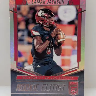 Sale Photo Thumbnail #596: 2018 Donruss Elite Rookie Elitist Lamar Jackson trading card in University of Louisville uniform with metallic parallel finish.