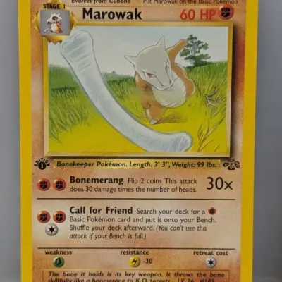 Sale Photo Thumbnail #609: 1st Edition Marowak #39/64 Pokémon trading card from the 1999 Jungle set, illustrated by Mitsuhiro Arita.