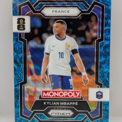 Sale Photo Thumbnail #222: Panini Prizm Monopoly Kylian Mbappé trading card featuring France national football team branding and a patterned blue holo finish.