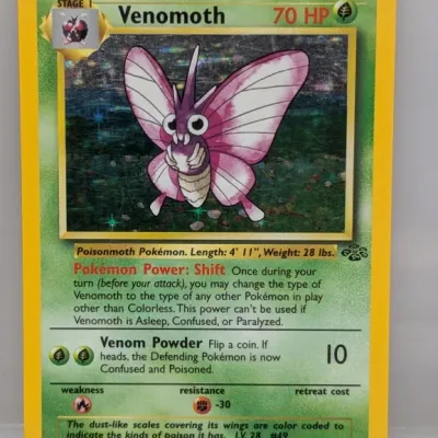 Sale Photo Thumbnail #114: 1999 Pokémon Jungle Set holographic Venomoth trading card, number 13/64.