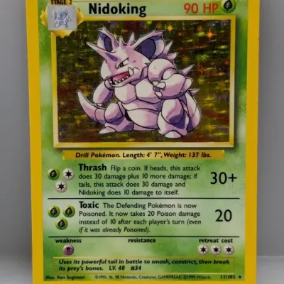 Sale Photo Thumbnail #782: 1999 Pokémon Base Set Holofoil Nidoking trading card (11/102), illustrated by Ken Sugimori.
