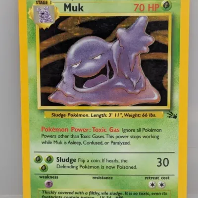 Sale Photo Thumbnail #98: 1999 Pokémon Fossil expansion set Muk holofoil card, number 13/62, illustrated by Mitsuhiro Arita.