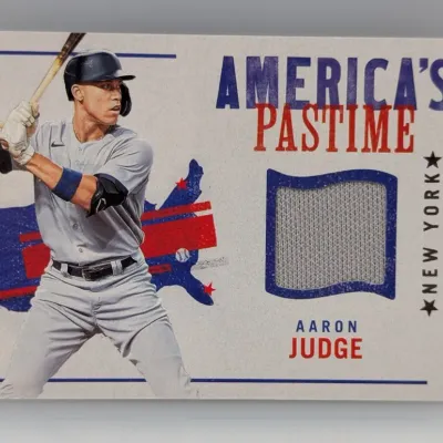 Sale Photo Thumbnail #259: Aaron Judge "America's Pastime" baseball trading card featuring an embedded game-used jersey relic swatch.