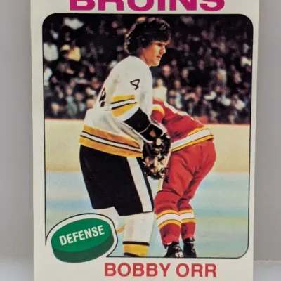 Sale Photo Thumbnail #567: 1974-75 Topps Bobby Orr #100 hockey trading card featuring the Boston Bruins defenseman in fair condition with slight edge wear.