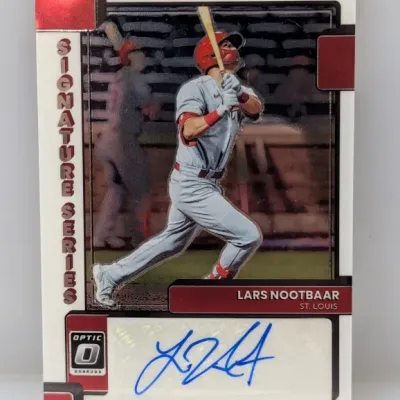 Sale Photo Thumbnail #416: Panini Donruss Optic Signature Series Lars Nootbaar autographed baseball card featuring a sticker signature in blue ink.