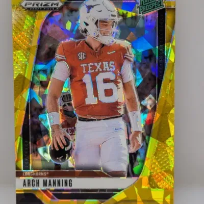 Sale Photo Thumbnail #126: Panini Prizm Draft Picks Arch Manning 'Rated Prospect' yellow cracked ice parallel trading card featuring him in his Texas Longhorns uniform.