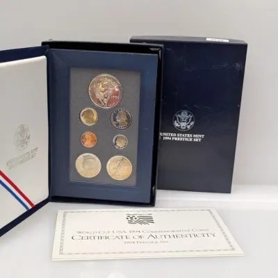 Sale Photo Thumbnail #1057: United States Mint 1994 Prestige Set featuring World Cup USA 1994 commemorative coins, complete with original display case, outer box, and Certificate of Authenticity.