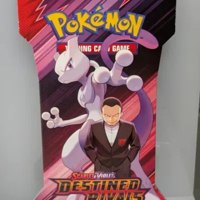 Sale Photo Thumbnail #580: Sealed Pokémon TCG Scarlet & Violet Destined Rivals booster blister pack, featuring Mewtwo and Giovanni artwork.