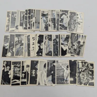 Sale Photo Thumbnail #678: Collection of vintage 1960s A&BC or Topps The Beatles black and white trading cards with printed facsimile signatures.