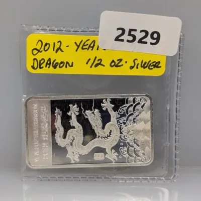 Sale Photo Thumbnail #1020: 2012 Year of the Dragon 1/2 oz fine silver bar in protective plastic flip.