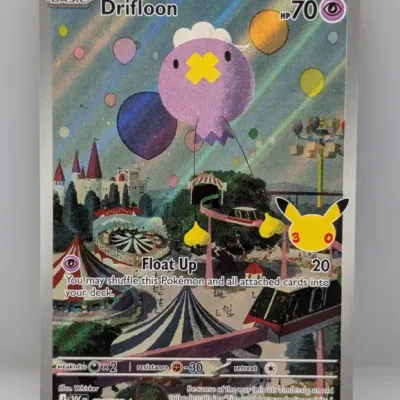 Sale Photo Thumbnail #747: Pokémon Trading Card Game Drifloon secret rare full-art card (136/128) featuring a Pikachu 25th anniversary stamp.