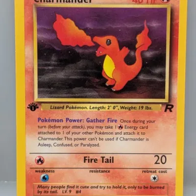 Sale Photo Thumbnail #448: 1st Edition Team Rocket Charmander Pokémon trading card (#50/82), released by Wizards of the Coast in 2000.