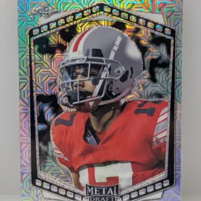 Sale Photo Thumbnail #671: Leaf Metal Draft Chris Olave trading card featuring a prismatic holographic background and Ohio State uniform.
