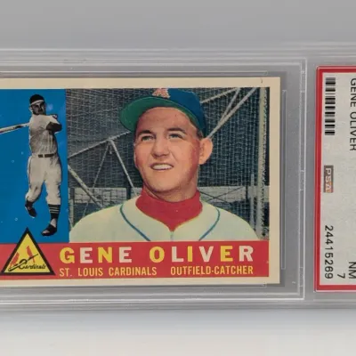 Sale Photo Thumbnail #297: PSA-graded 7 NM 1960 Topps Gene Oliver baseball card #307, encased in a protective slab.