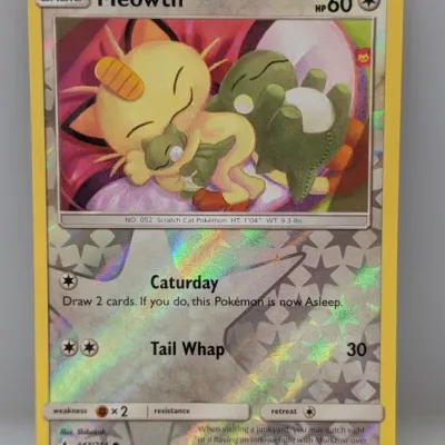 Sale Photo Thumbnail #276: 2019 Pokémon Sun & Moon: Unbroken Bonds Meowth reverse holo trading card (#147/214), featuring artwork by Shibuzoh.