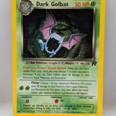 Sale Photo Thumbnail #728: Holographic Dark Golbat Pokémon trading card from the Team Rocket expansion, numbered 7/82.