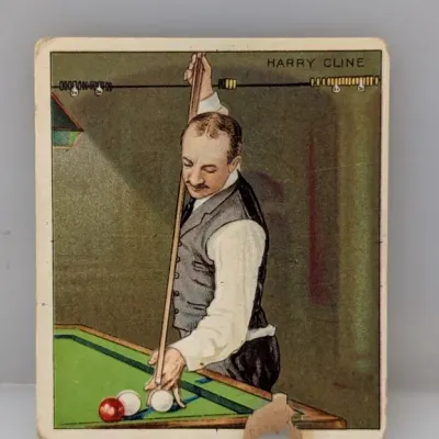 Sale Photo Thumbnail #357: Vintage Mecca Cigarettes T218 tobacco card featuring billiards player Harry Cline, circa 1910. Shows noticeable edge wear and a paper chip along the bottom edge.