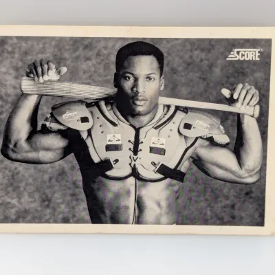 Sale Photo Thumbnail #614: 1990 Score Bo Jackson #697 baseball card featuring his iconic shoulder pads and bat pose.
